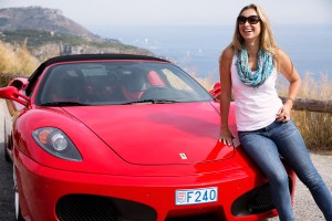 Julia driving a Ferrari in Italy.