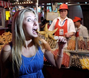 Julia eating a starfish in China.